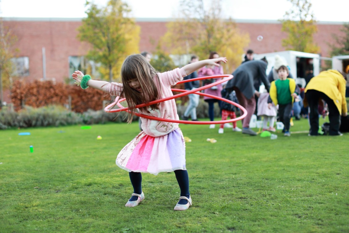 A little girl enjoys playing in the Richmond Barracks garden