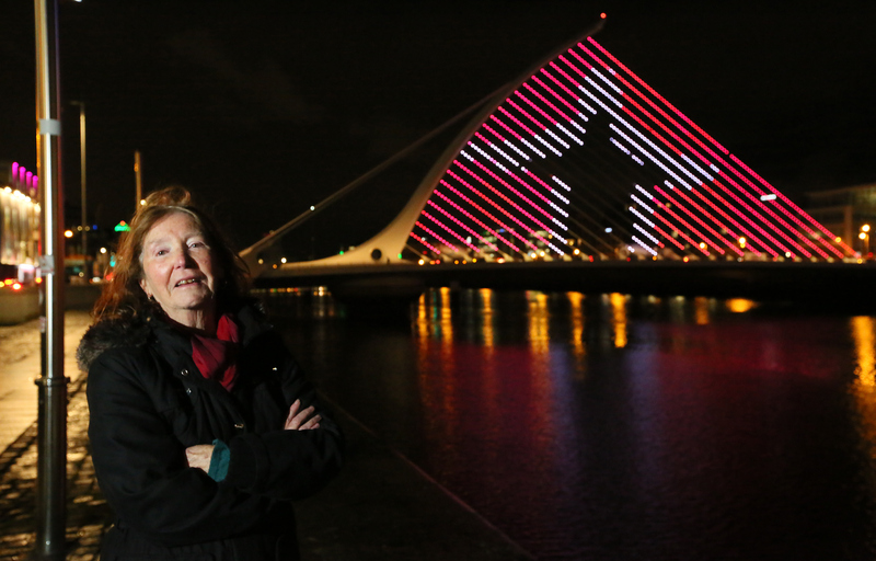 Participant Christine with the group’s light display on the Beckett Bridge. Photo: Mark Stedman.