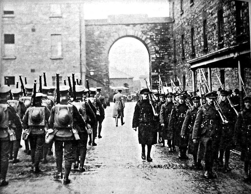The British army, on the left, leaves Richmond Barracks as the newly formed Irish army Arrives in 1922. Credit: National Library of Ireland.