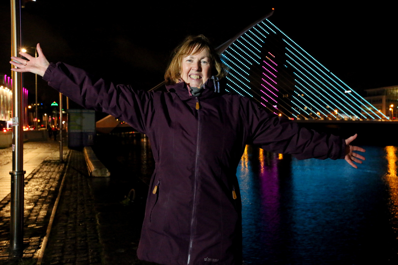 Participant Mary with her light display on the Beckett Bridge. Photo: Mark Stedman.