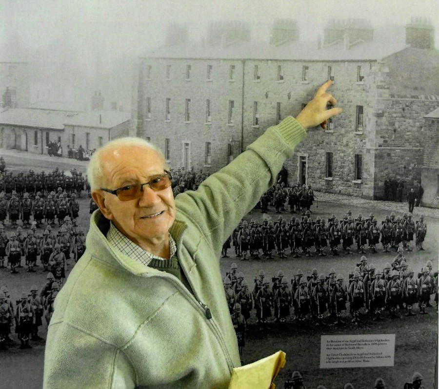 Dinny Timmins shows his grandmother’s home where he was born in Keogh Square. The family lived on the other side of the square from where you are standing now, near Finnerty’s shop. Credit: Photo by John Peacock, courtesy of Liam O’Meara.