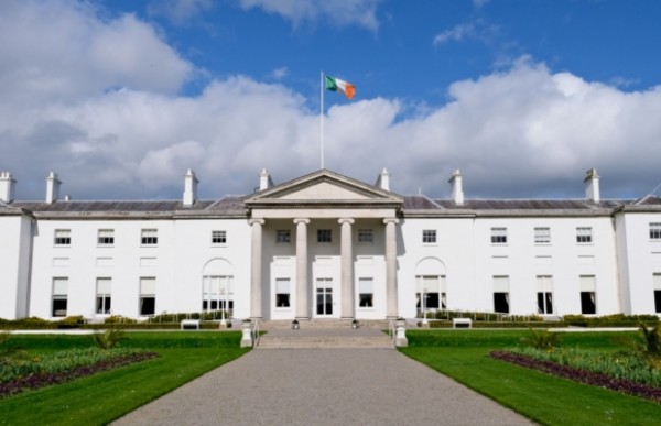 A large white building with flags